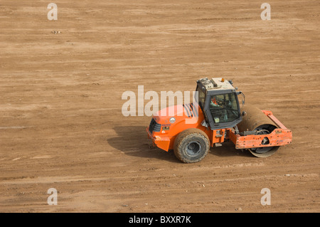 Vibratory soil compactor. HAMM 3000 series in action. Stock Photo