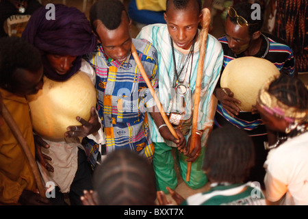 In the town of Djibo in northern Burkina Faso, young 'doohoobe' (people who sing 'doohaali') dance in traditional fashion. Stock Photo