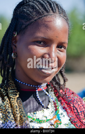 Young Fulani woman in the seasonal village of Bantagiri in northern Burkina Faso.  The Fulani are nomadic pastoralists. Stock Photo