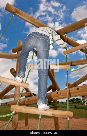 A MODEL RELEASED picture of an eleven year old boy on a climbing frame in the Uk Stock Photo