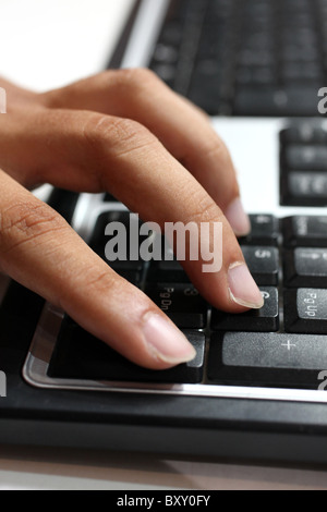 Male hand on computer keyboard. Stock Photo
