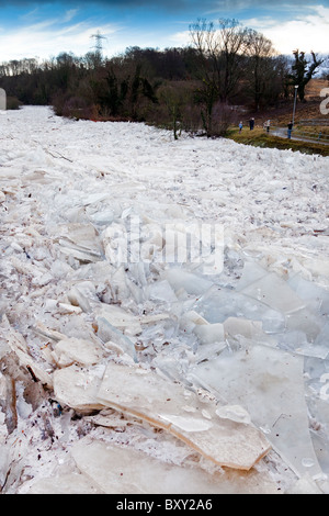 River Ayr frozen over and the ice breaking up into slabs and piling up against one another. River Ayr, Ayr, Ayrshire, Scotland Stock Photo