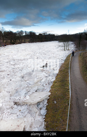 River Ayr frozen over and the ice breaking up into slabs and piling up against one another. River Ayr, Ayr, Ayrshire, Scotland Stock Photo