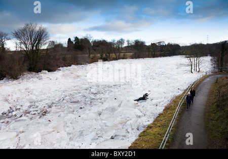 River Ayr frozen over and the ice breaking up into slabs and piling up against one another. River Ayr, Ayr, Ayrshire, Scotland Stock Photo