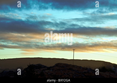 Telegraph pole in rural landscape Stock Photo