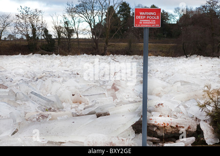 River Ayr frozen over and the ice breaking up into slabs and piling up against one another. River Ayr, Ayr, Ayrshire, Scotland Stock Photo