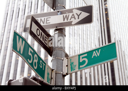 5th Avenue street sign and one way street signs at West 58th St in New York, America Stock Photo