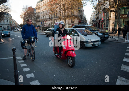 Paris, France, people Driving, Busy Street Scenes, Traffic, Bicycle and Motor Scooter. cars traffic centre Paris, urban mobility, paris driving Stock Photo