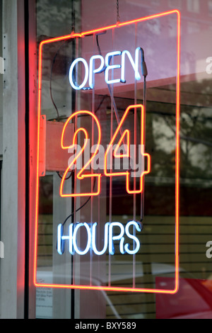 Open 24 hours neon sign in New York, America Stock Photo