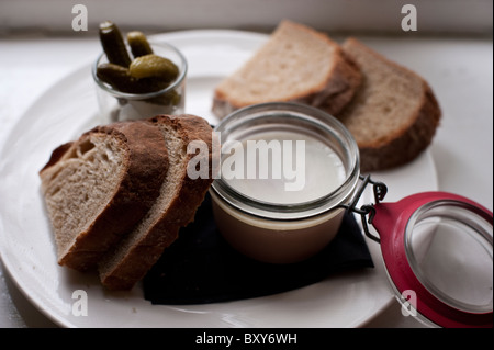 Chicken liver pate served with brown bread and cornichon pickles served at the Perch in Oxford. Stock Photo