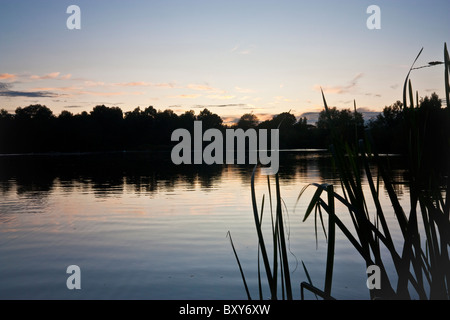 Reflections on the surface of one of the lakes in Lyng, UK