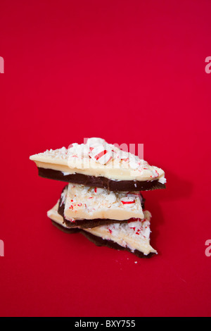 Homemade peppermint bark on a red background Stock Photo