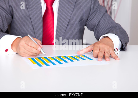 Analyzing the business progress in a bar chart (selective focus) Stock Photo