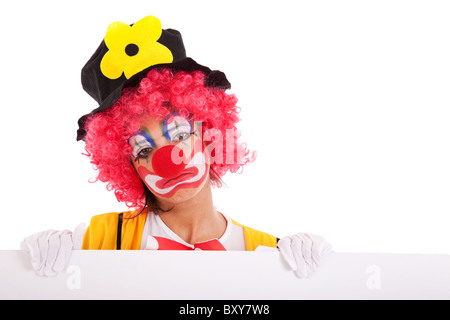 sad clown holding a blank banner (isolated on white) Stock Photo