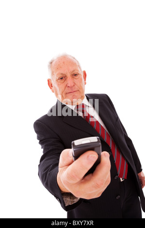 senior businessman sending a text message with his mobile phone Stock Photo