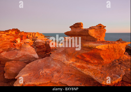 Red pindan cliffs at sunset, Gantheaume Point, Broome, Kimberley, Western Australia Stock Photo