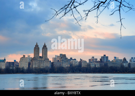 Central Park Skyline over lake at dusk, New York City Stock Photo