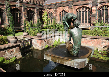 City of Chester, England. Chester Cathedral’s Cloister Garden with the Stephen Broadbent, Water of Life bronze water sculpture. Stock Photo