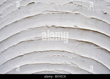 texture with white cement and plaster bas relief lines and spatula Stock Photo