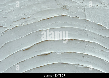 texture with white cement and plaster bas relief lines and spatula Stock Photo