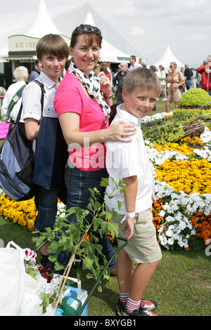 RHS Tatton, Cheshire. Family buying plants during the plant madness event at the end of Royal Horticultural Society Tatton. Stock Photo