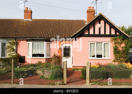 Mock tudor pink semi detached bungalow Ipswich Suffolk UK Stock Photo