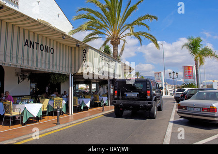 Luxury car and shops at the exclusive yacht harbour of Puerto Banús, Marbella, Costa del Sol. Málaga province, Andalusia, Spain Stock Photo