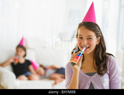 Girls with party blowers on a birthday party Stock Photo - Alamy