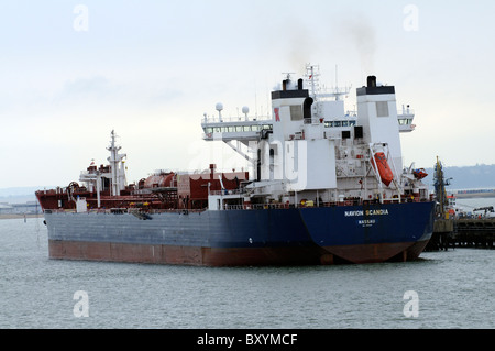 The Navion Scandia a oil carrying tanker alongside a jetty at Fawley Refinery on Southampton Water England Stock Photo