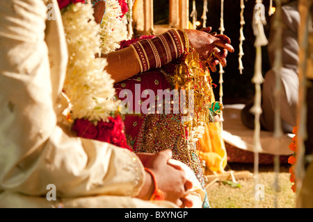 Couple in ornate, traditional Indian wedding clothing Stock Photo