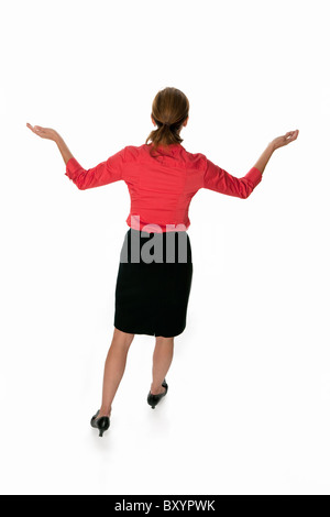 Backview of a business woman with arms raised Stock Photo