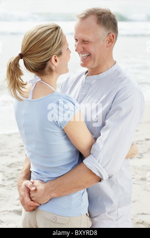 Portrait of couple embracing on beach Stock Photo