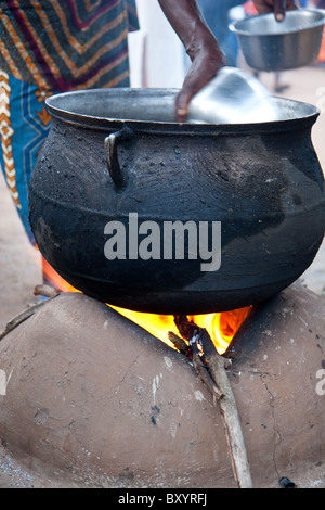 Cooking on an open fire with a cast iron pot in South Africa Stock ...