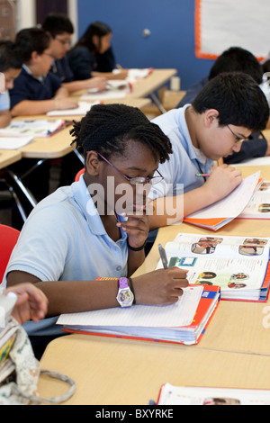 African American and Hispanic male and female students in Spanish class at Peak Preparatory Academy public charter high school Stock Photo