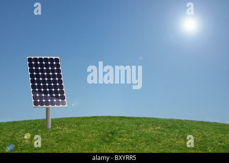 Solar panel in grass with blue sky Stock Photo