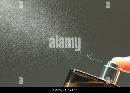 spray from aftershave / perfume bottle Stock Photo