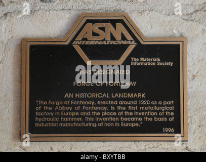 ASM International Materials Information Society bronze metal plaque at Forge of Fontenay Abbey France for invention of hydraulic Stock Photo