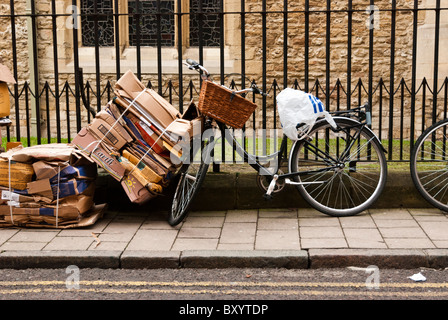Cardboard baled up and let out for collection for recycling in Ship Street, Oxford, Oxfordshire Stock Photo