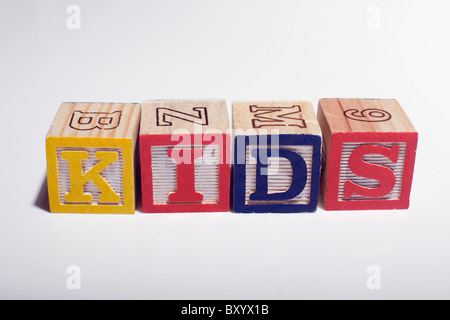 Multi-colored wooden letter blocks making the alphabet on white wood  background Stock Photo - Alamy