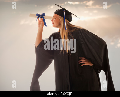 Young girl wearing graduating gown Stock Photo