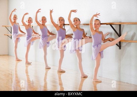 Row of female ballet dancers in dance studio Stock Photo