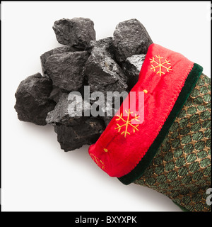 Coal in Christmas stocking Stock Photo