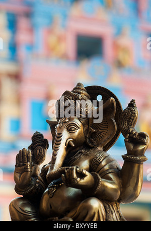 Bronze ganesha statue in front of Sathya Sai Baba's Gopuram ashram gate. Puttaparthi, Andhra Pradesh, India Stock Photo