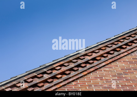Close-up of decorative brickwork forming part of the gable end of a house. Stock Photo