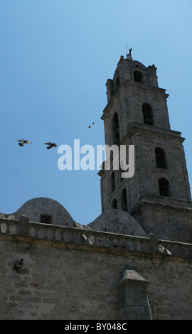 pigeons flying to the bell tower at th church San Francisco de Asis, on Plaza de San Francisco Havana, Cuba. Stock Photo