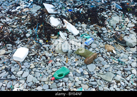 Plastic detritis and debris litter the rocks on a beach, County Clare, West Coast of Ireland Stock Photo