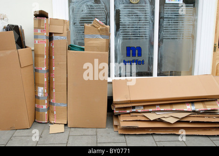 Cardboard boxes on pavement Stock Photo