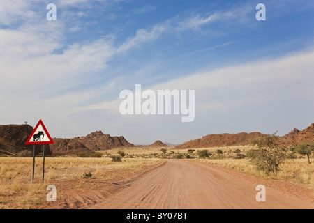 Elephant road sign & road, Damaraland, Namibia Stock Photo