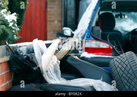A car being emptied out on a driveway to have some work carried out on the interior. Stock Photo