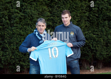 Roberto Mancini , manager, and Edin Dzekoi, the Bosnian striker, who  signed for Manchester City Stock Photo